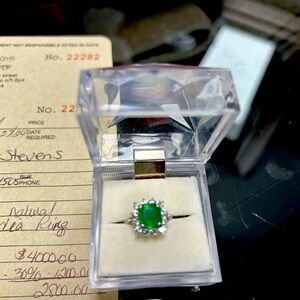 Platinum emerald and diamond ring